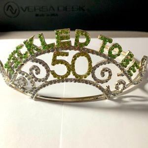Rhinestone “Tickled to be 50” tiara. Measures 5 3/4” widest part of headband.